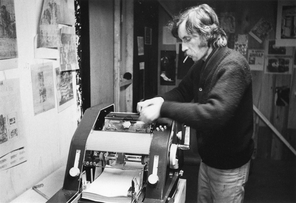 Gerry Gilbert using the Roneo Machine