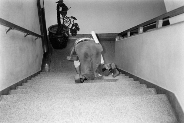 Poet Crawling down stairs